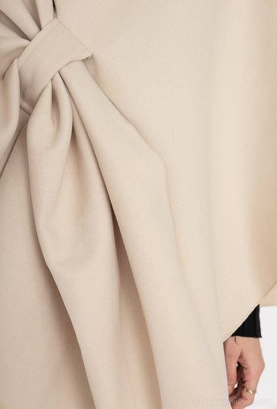 Poncho with bow